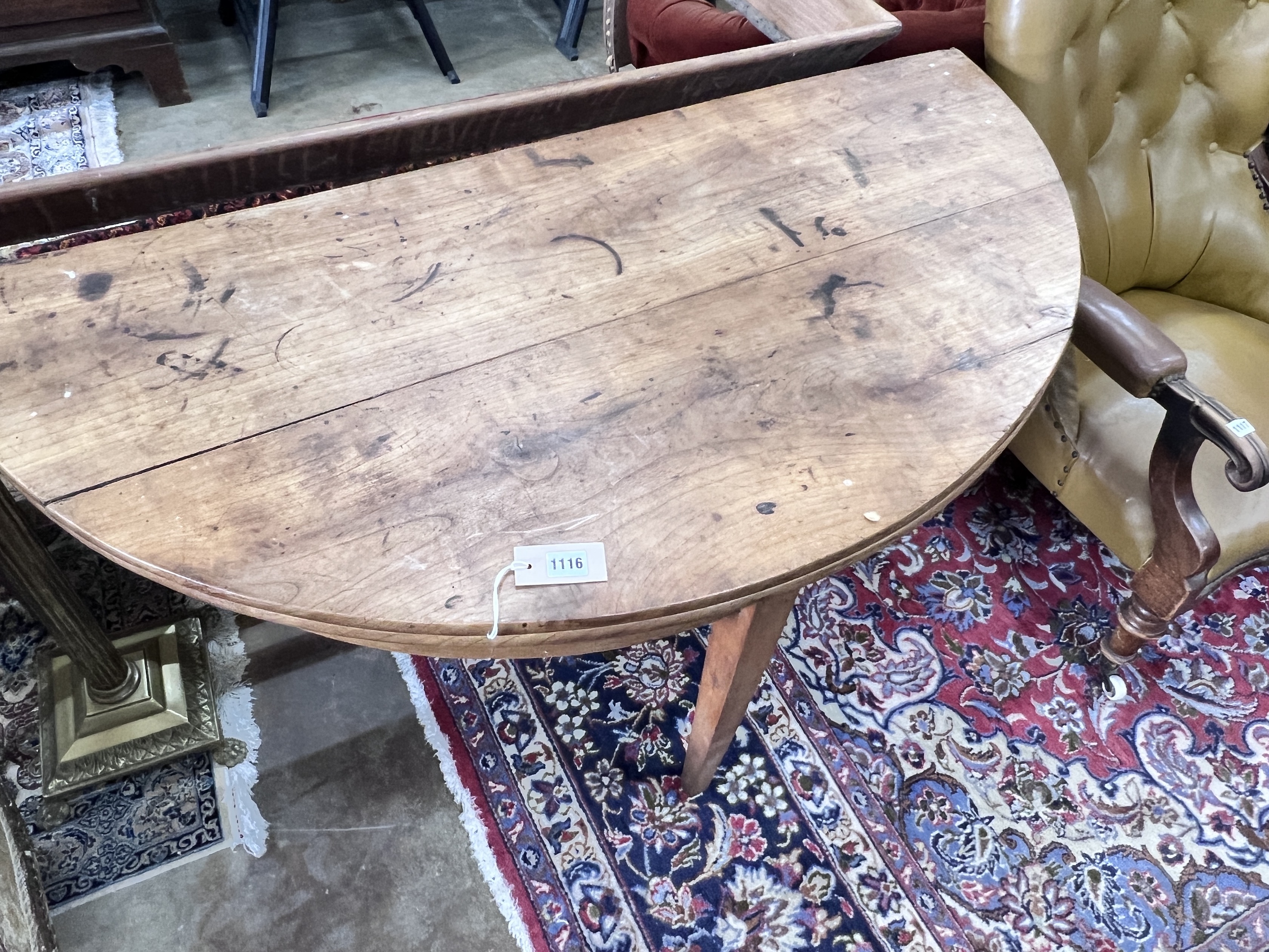 An early 19th century continental fruitwood D shaped folding tea table, width 124cm, depth 60cm, height 73cm